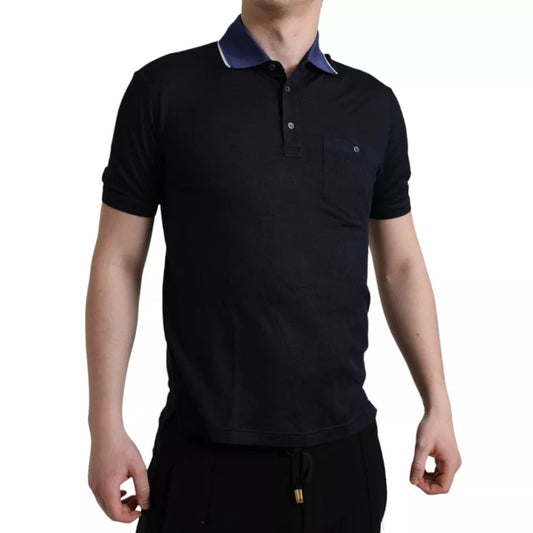 The man is wearing a dark polo shirt