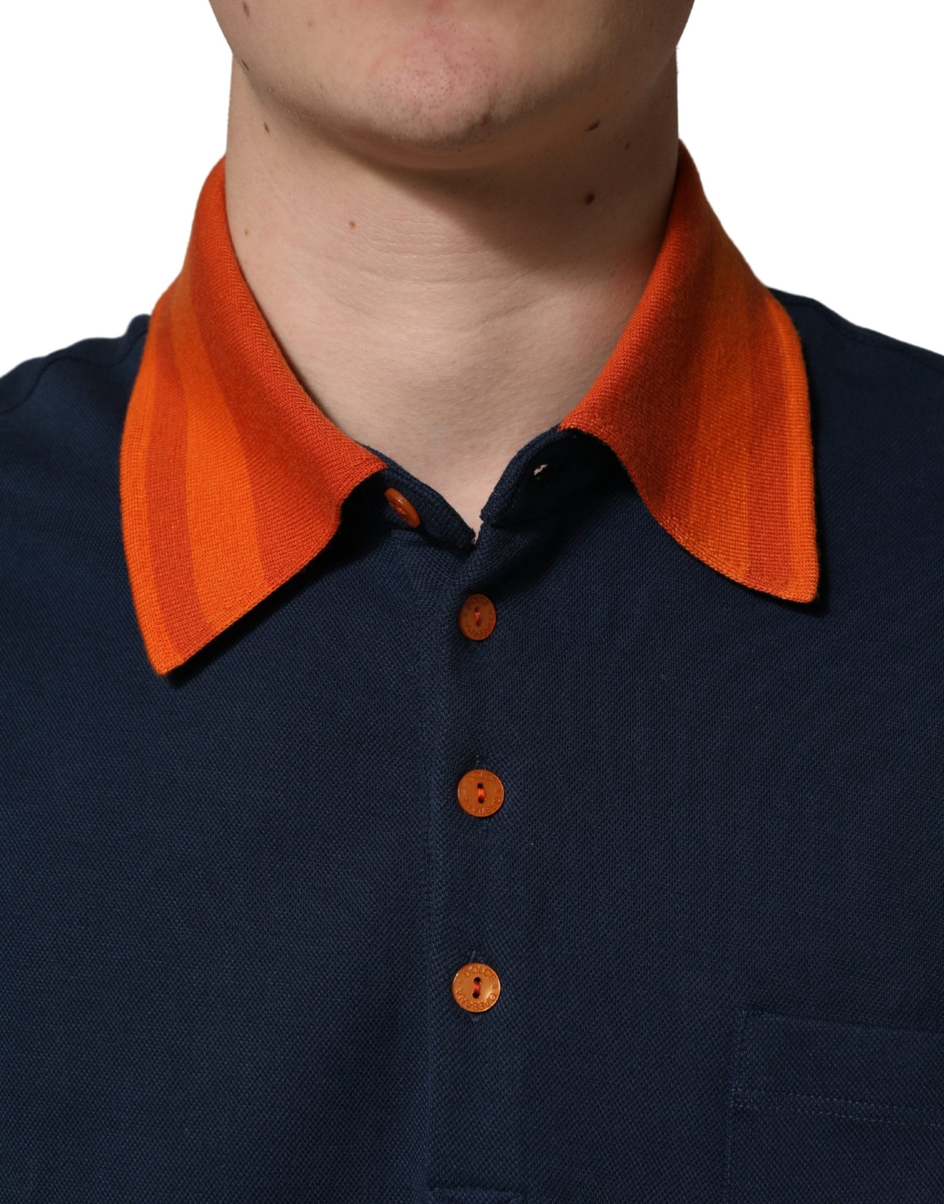 Man wearing blue shirt with orange collar
