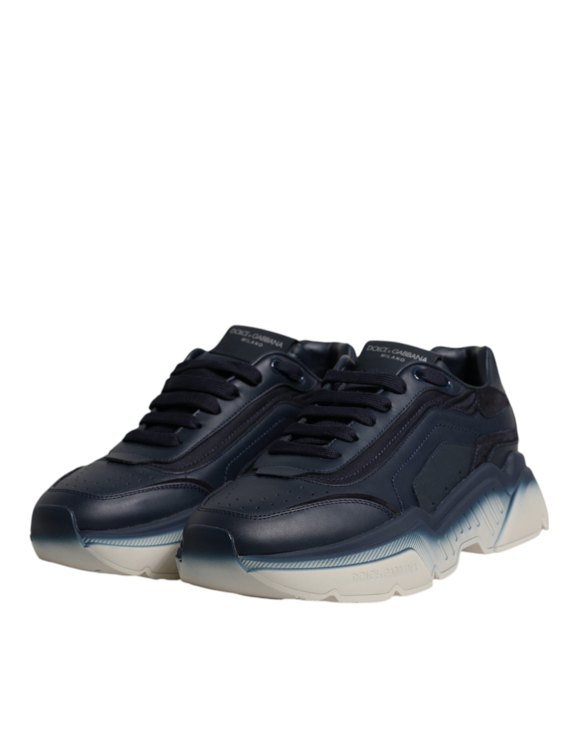Pair of navy blue men's sneakers with white soles and laces