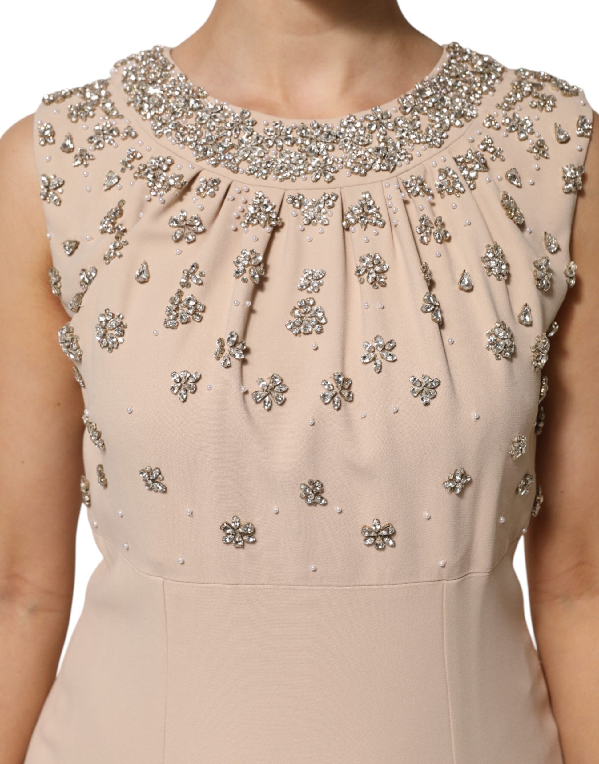 A beaded crystal embellished dress in nude ecru color