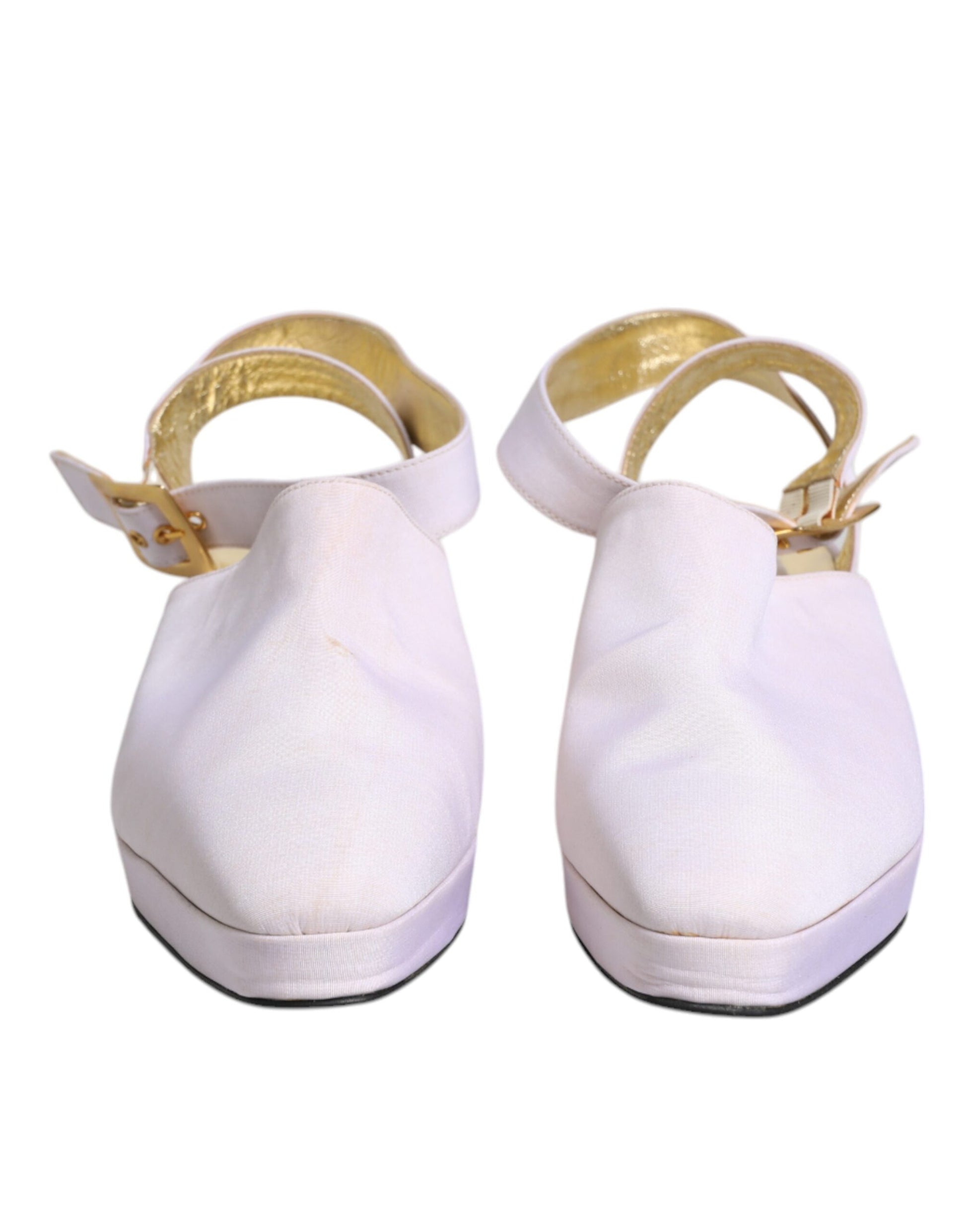 Pair of white sandals with gold accents