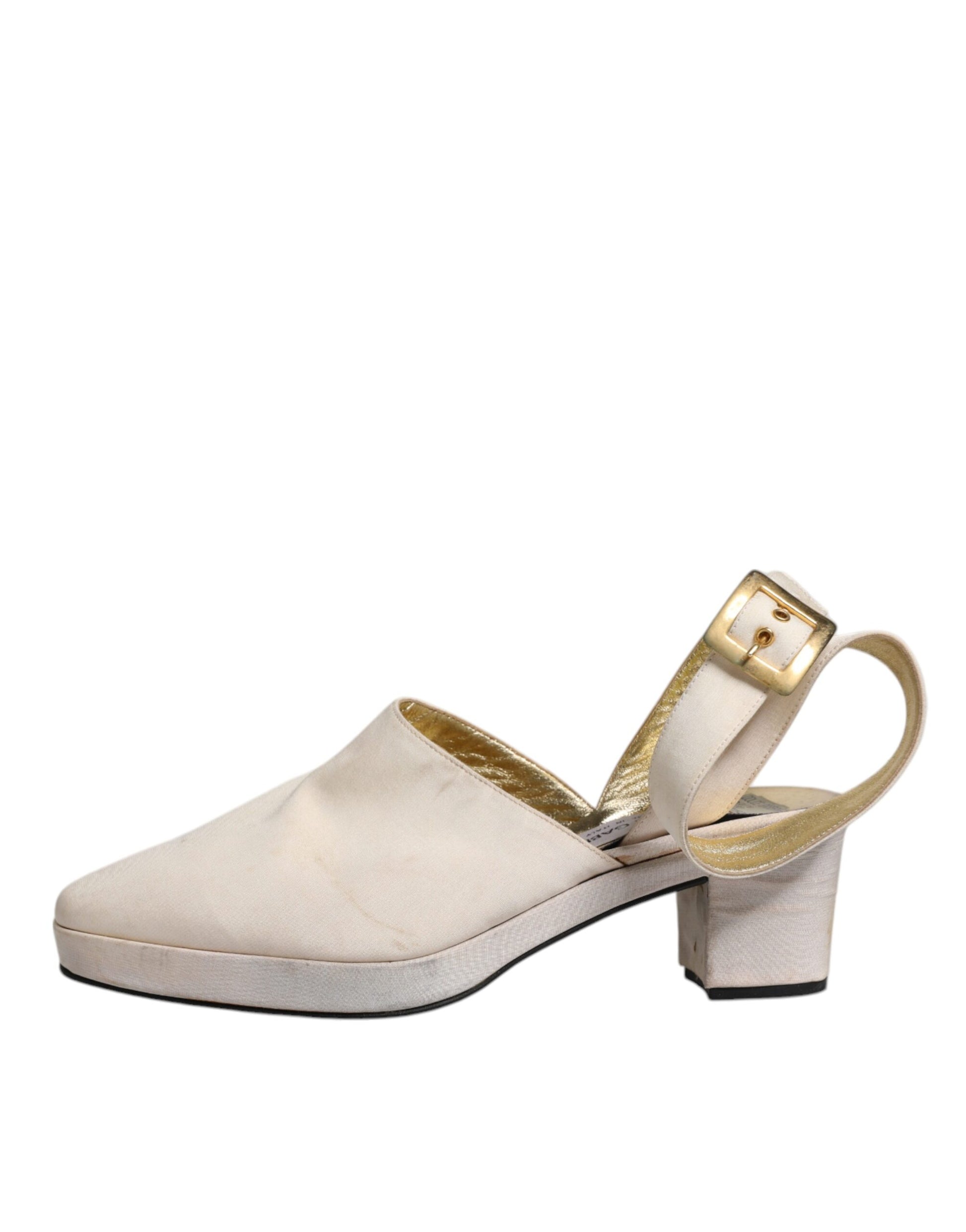 Tan high heel shoes with gold accents
