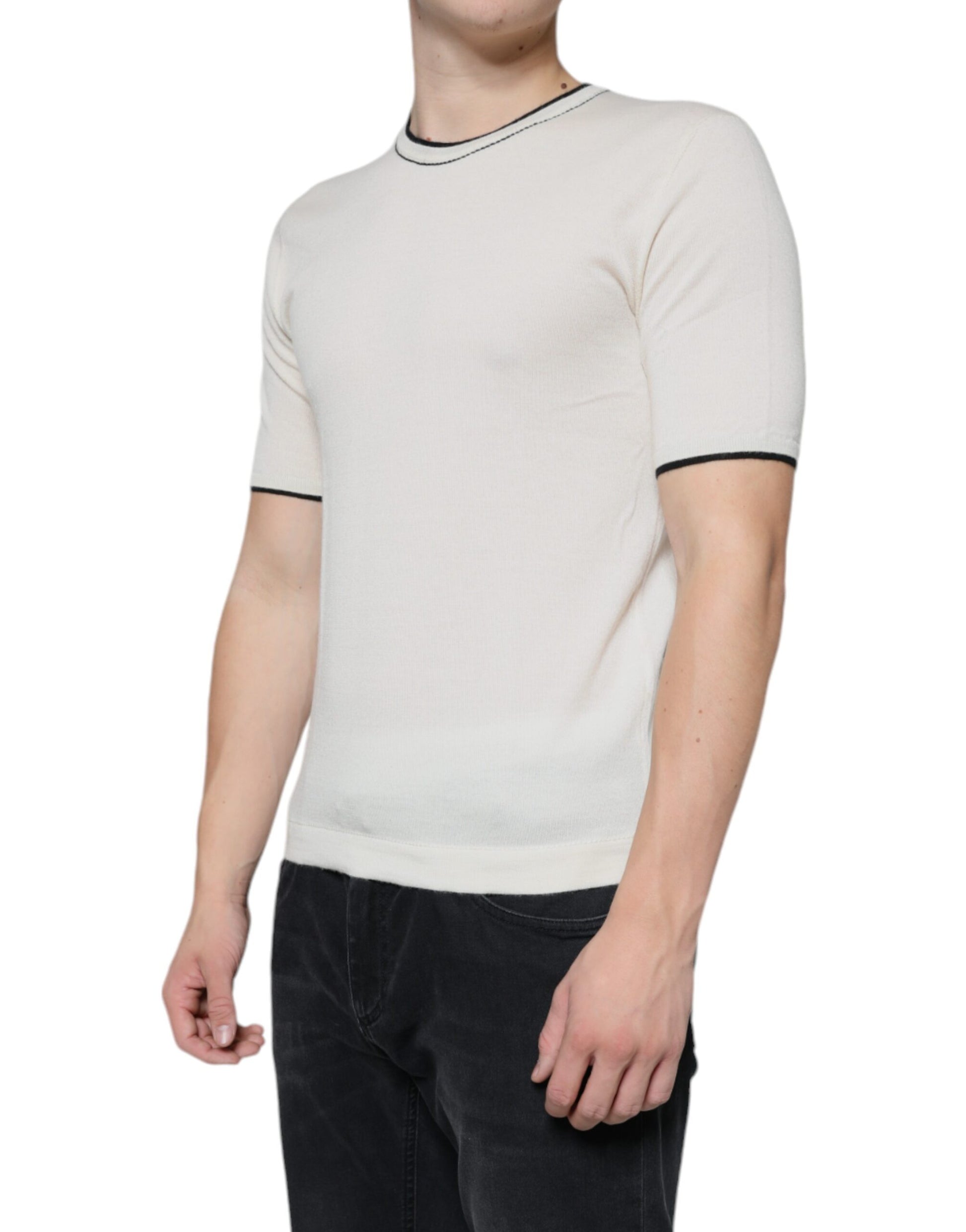 Man wearing a long sleeve shirt with horizontal stripes on the sleeves