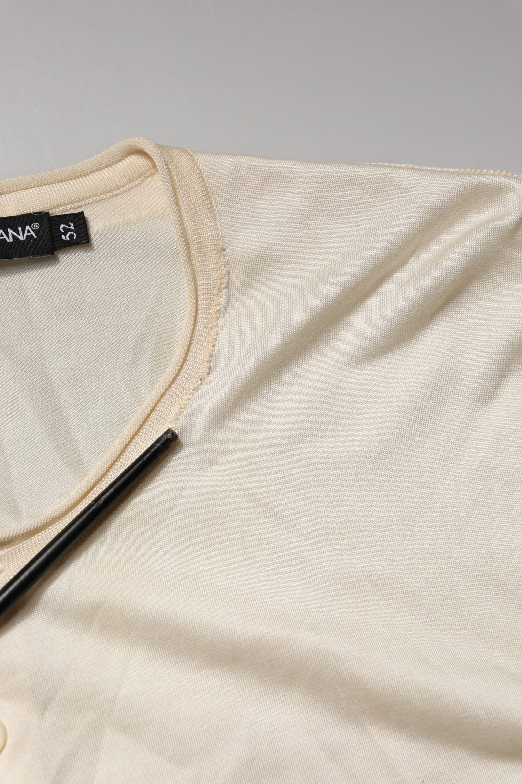 Tan shirt on hanger