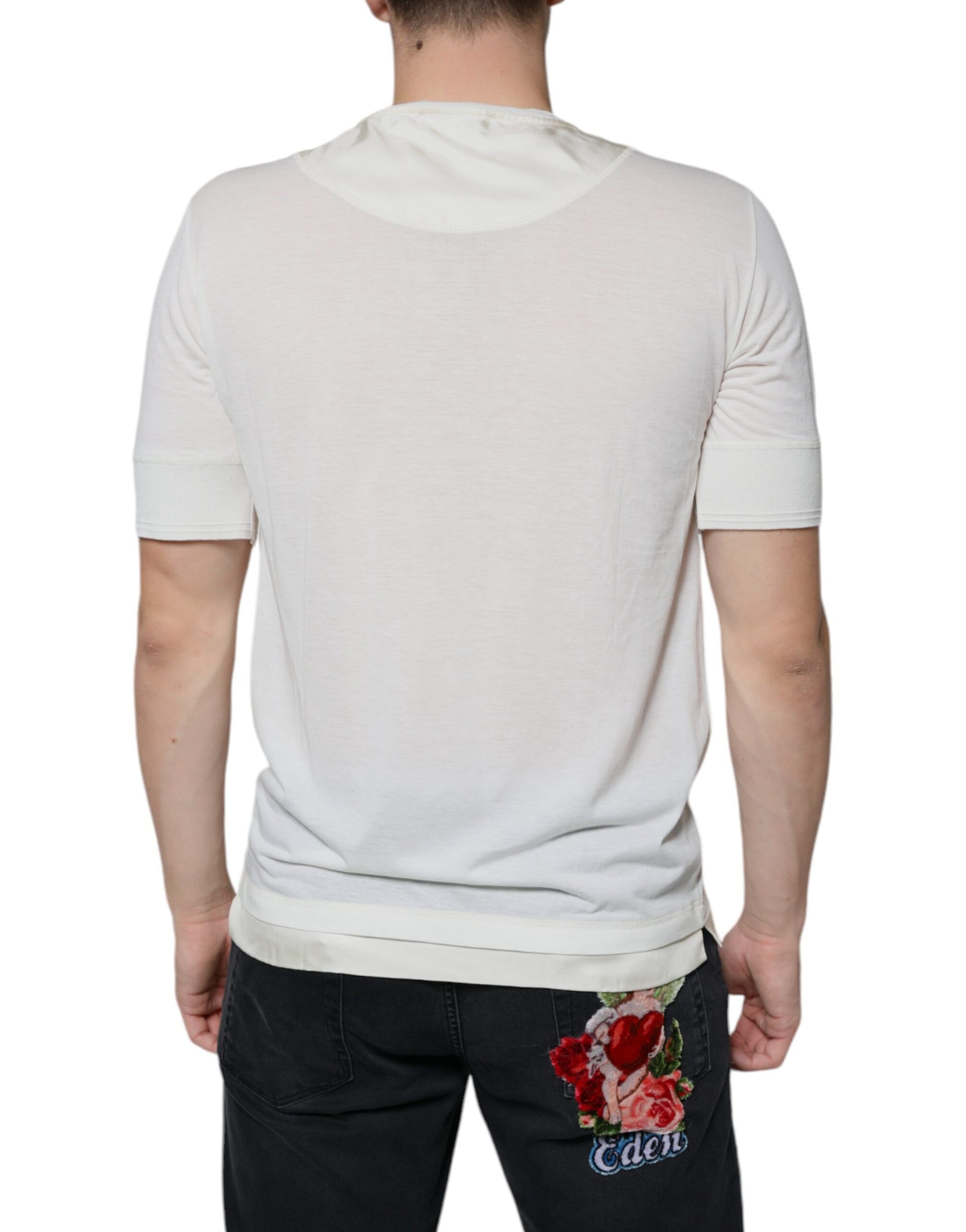 Man wearing white long sleeve shirt with floral design on back