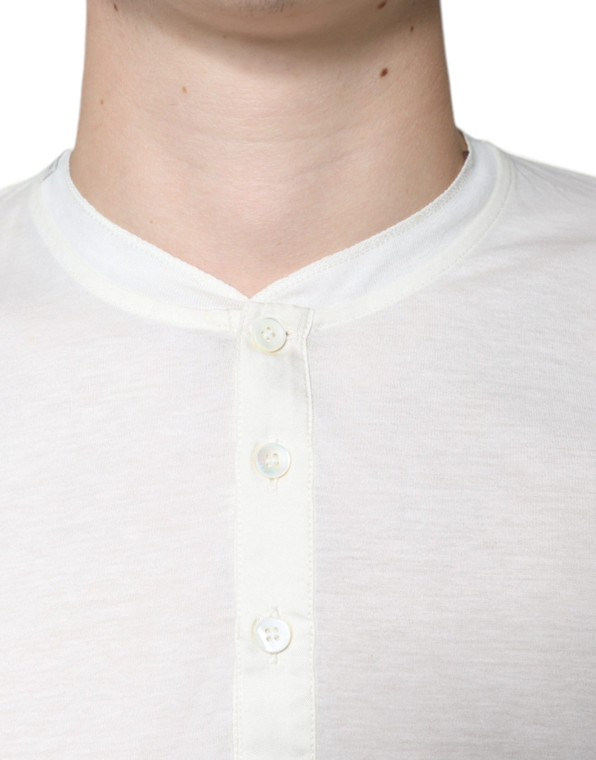 White collared shirt with buttons on neckline