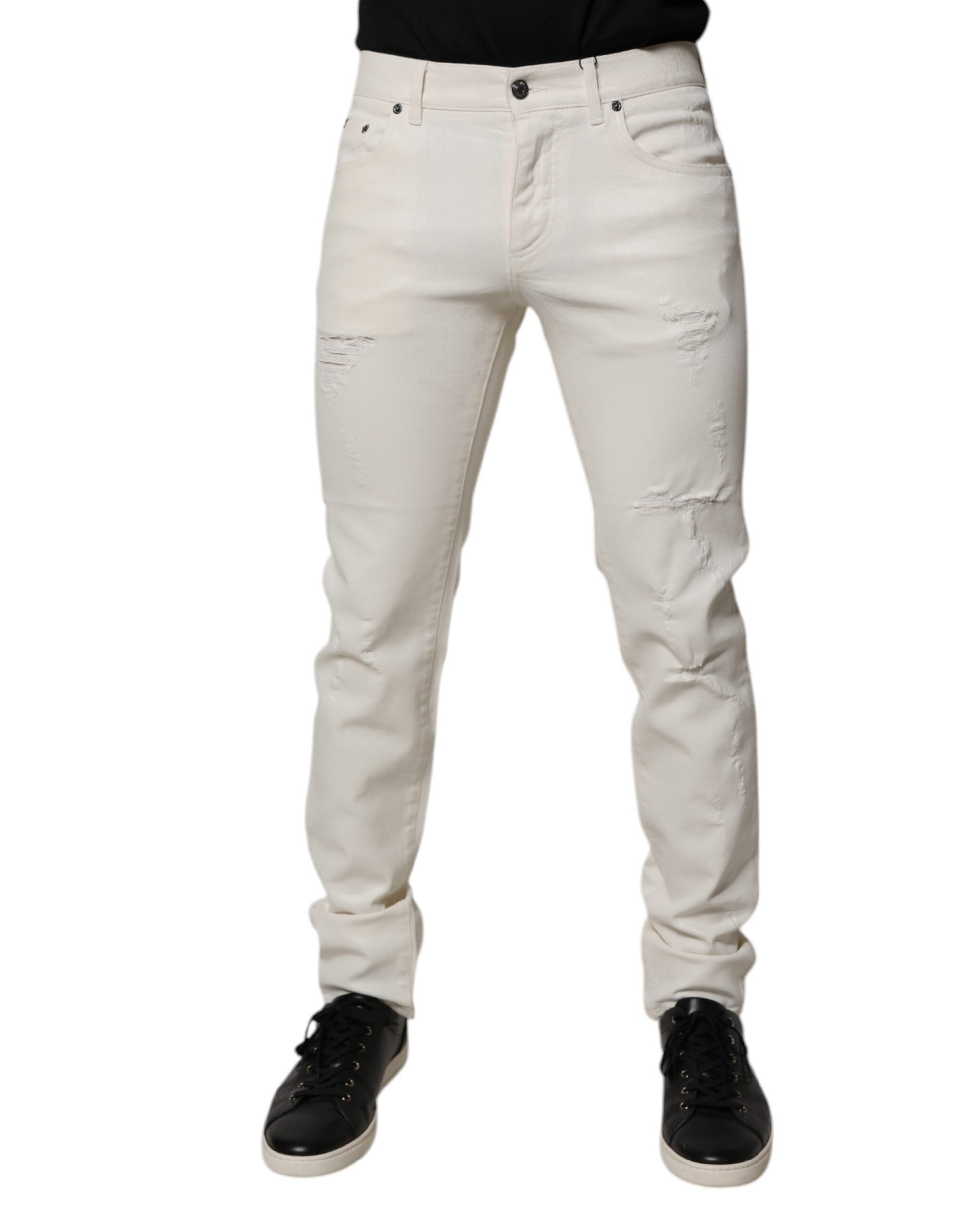 Pair of light wash denim jeans with distressed knees