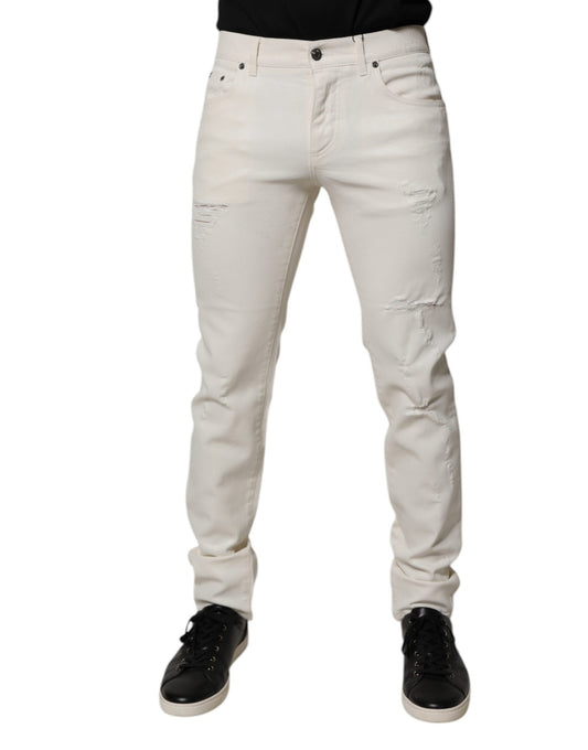 Pair of light wash denim jeans with distressed knees