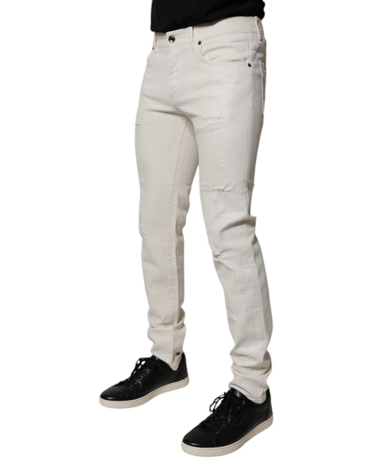 Pair of light wash jeans with distressed details on legs