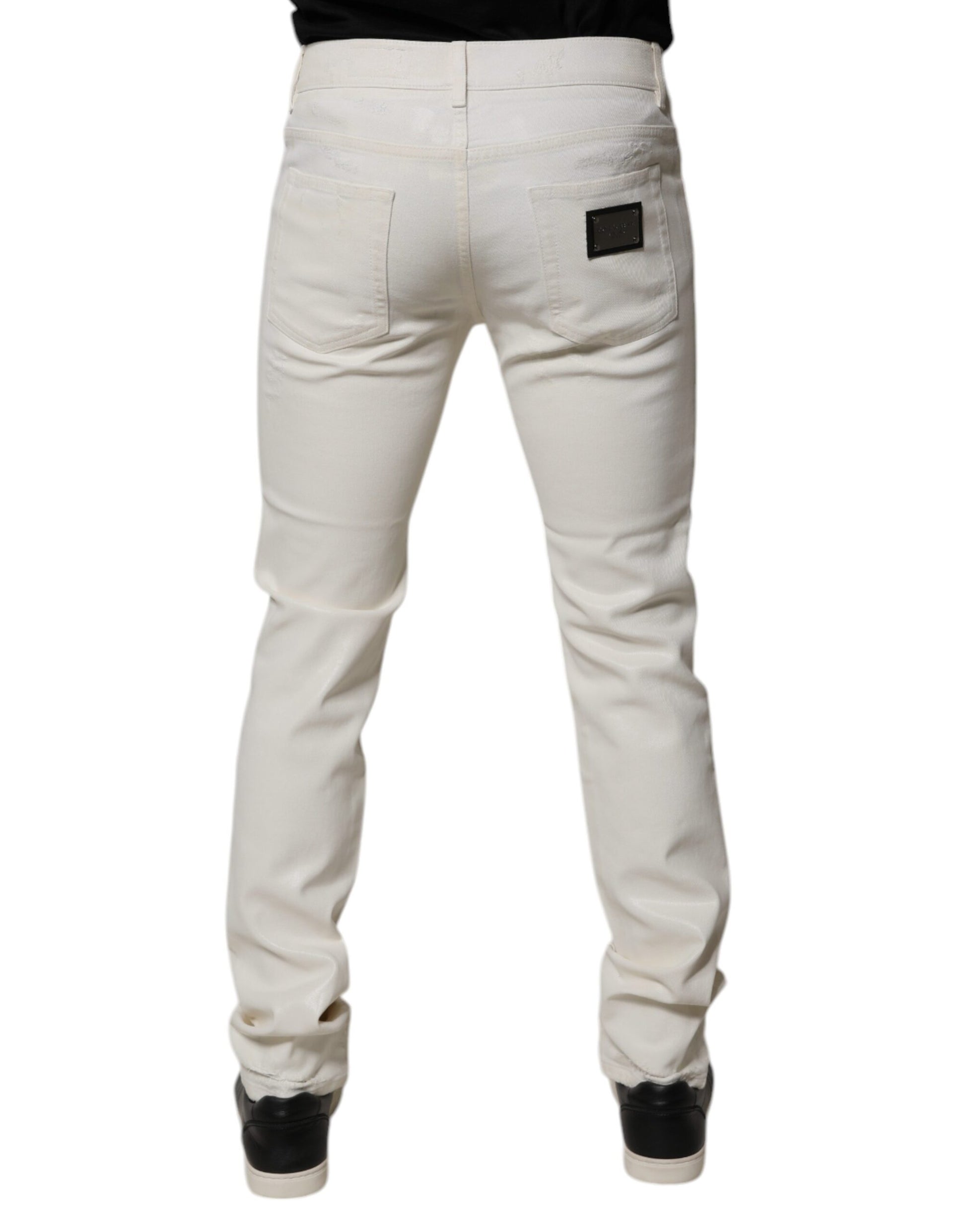Pair of light wash jeans with back pocket detailing