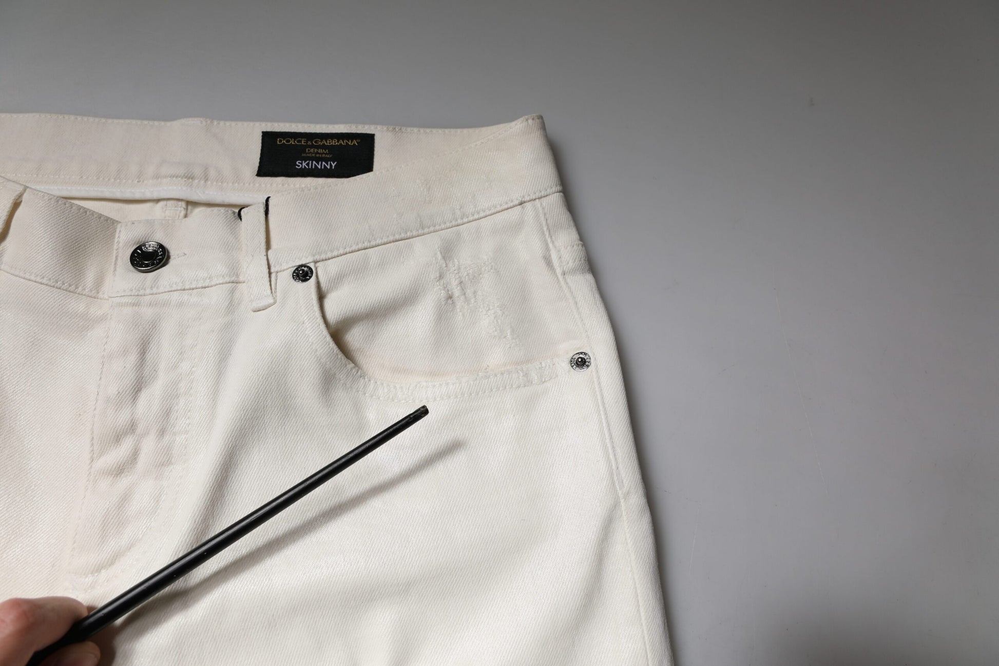 Pair of light colored jeans on a table