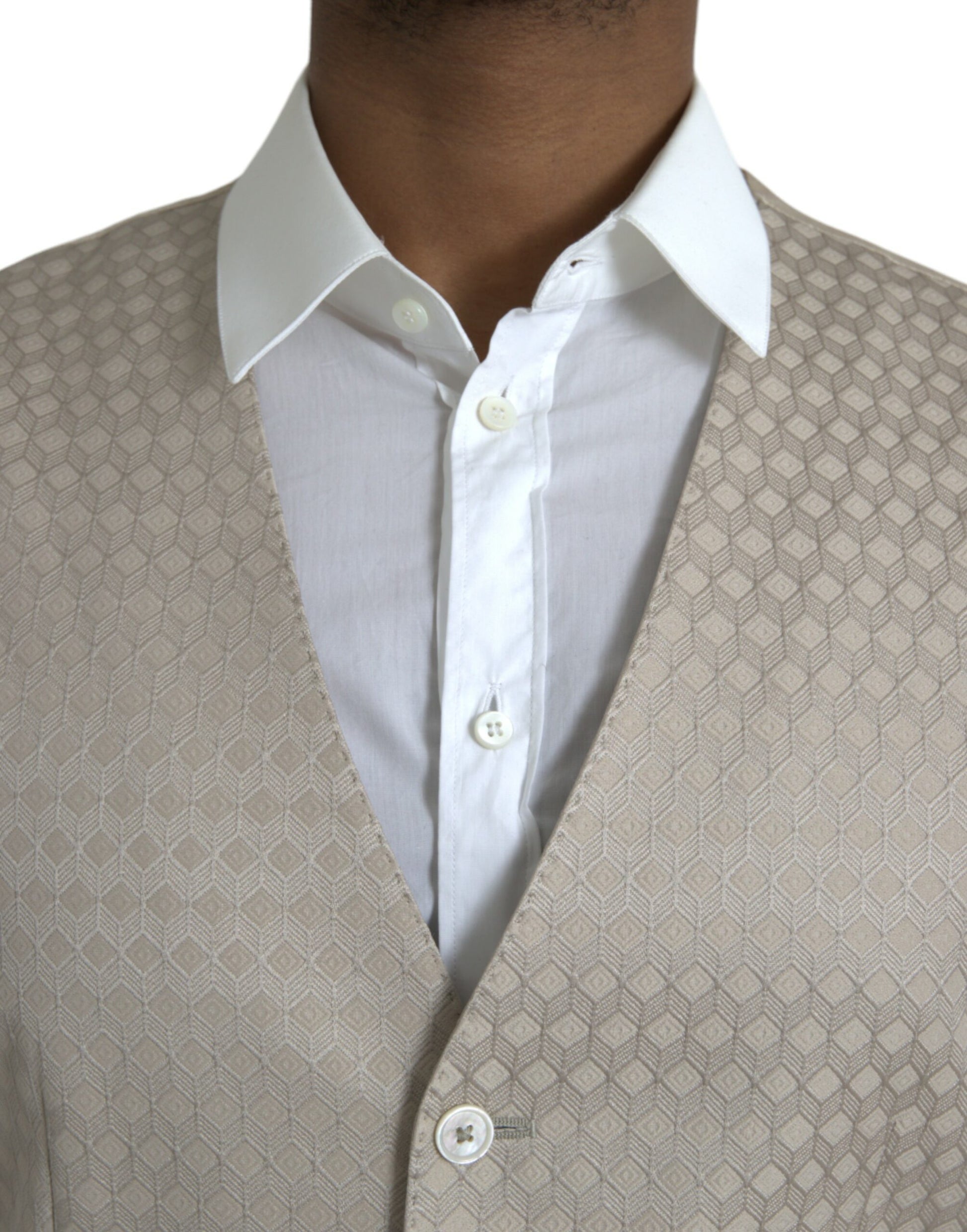 A mannequin wearing a beige waistcoat with a textured pattern