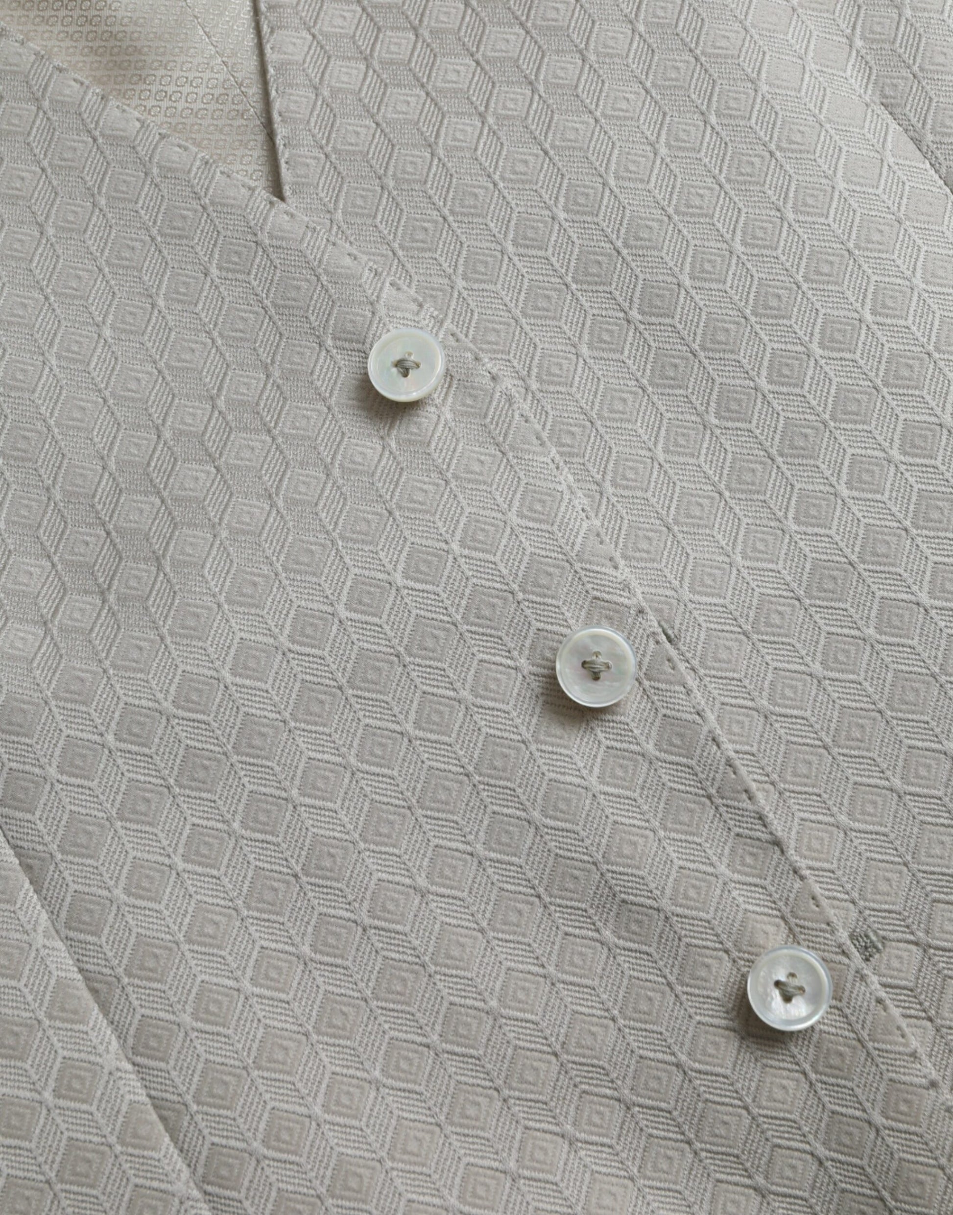 A close-up of a waistcoat with three buttons