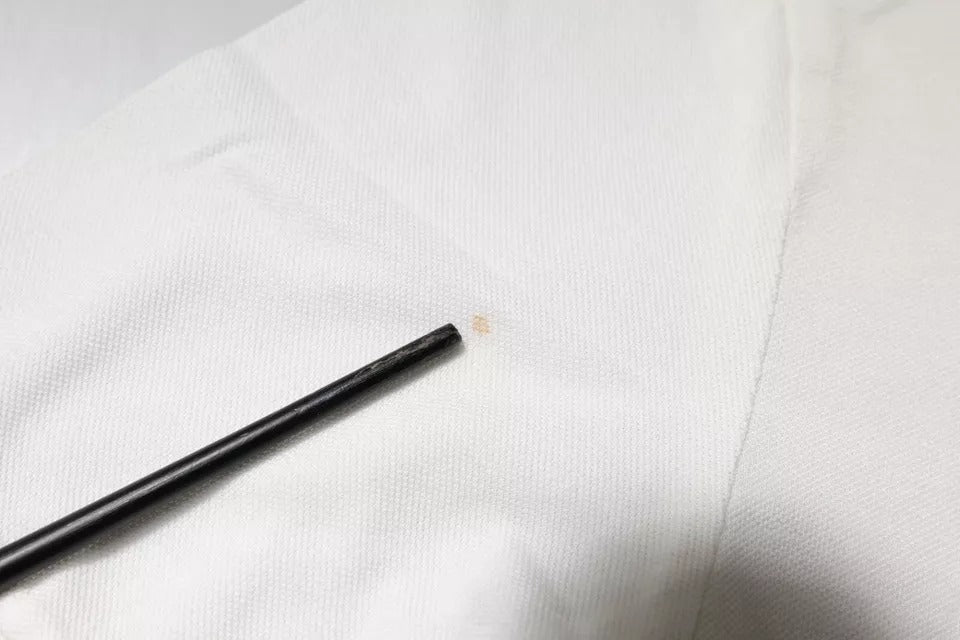 Black pen on white cloth