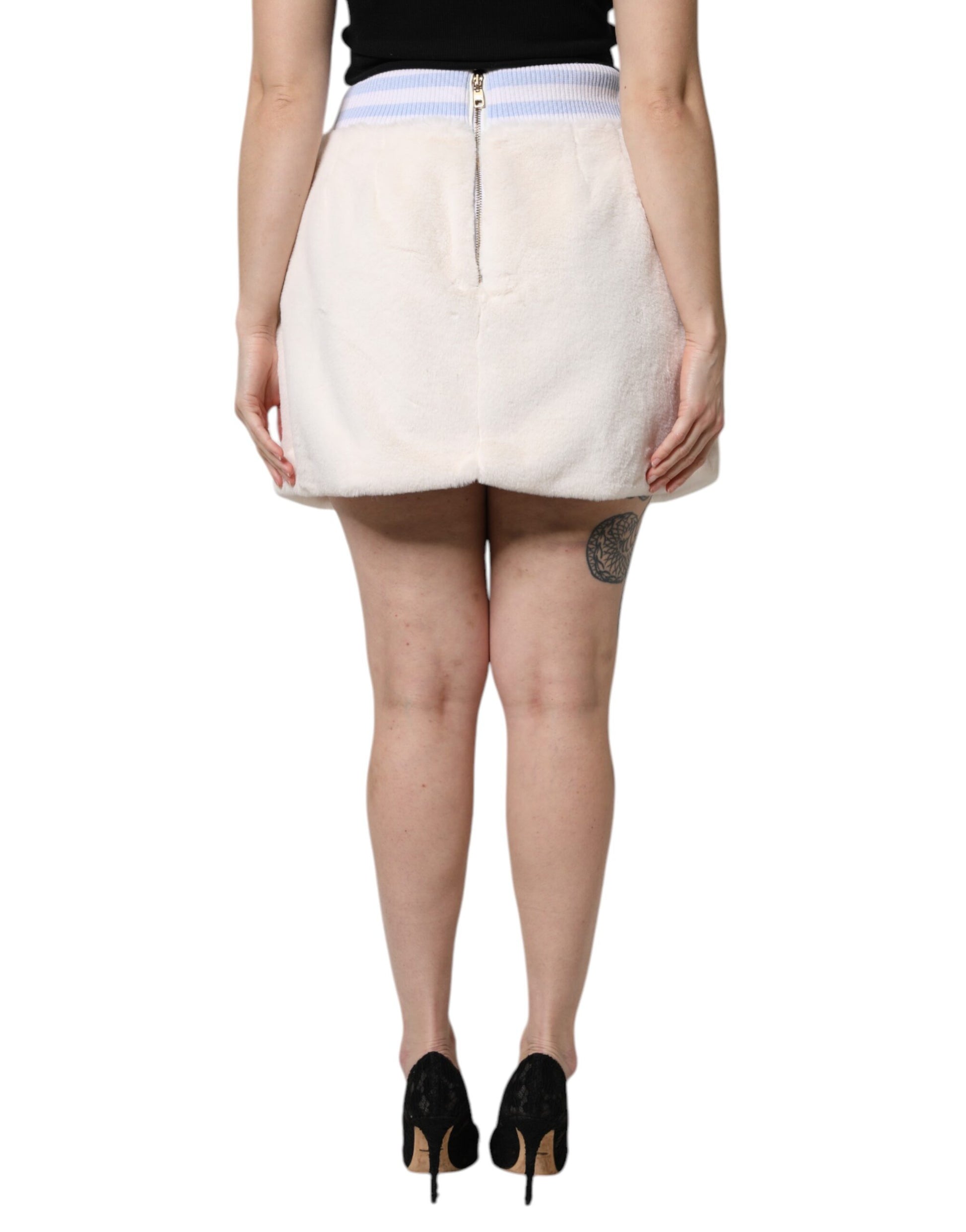 Woman wearing a short skirt and black heels