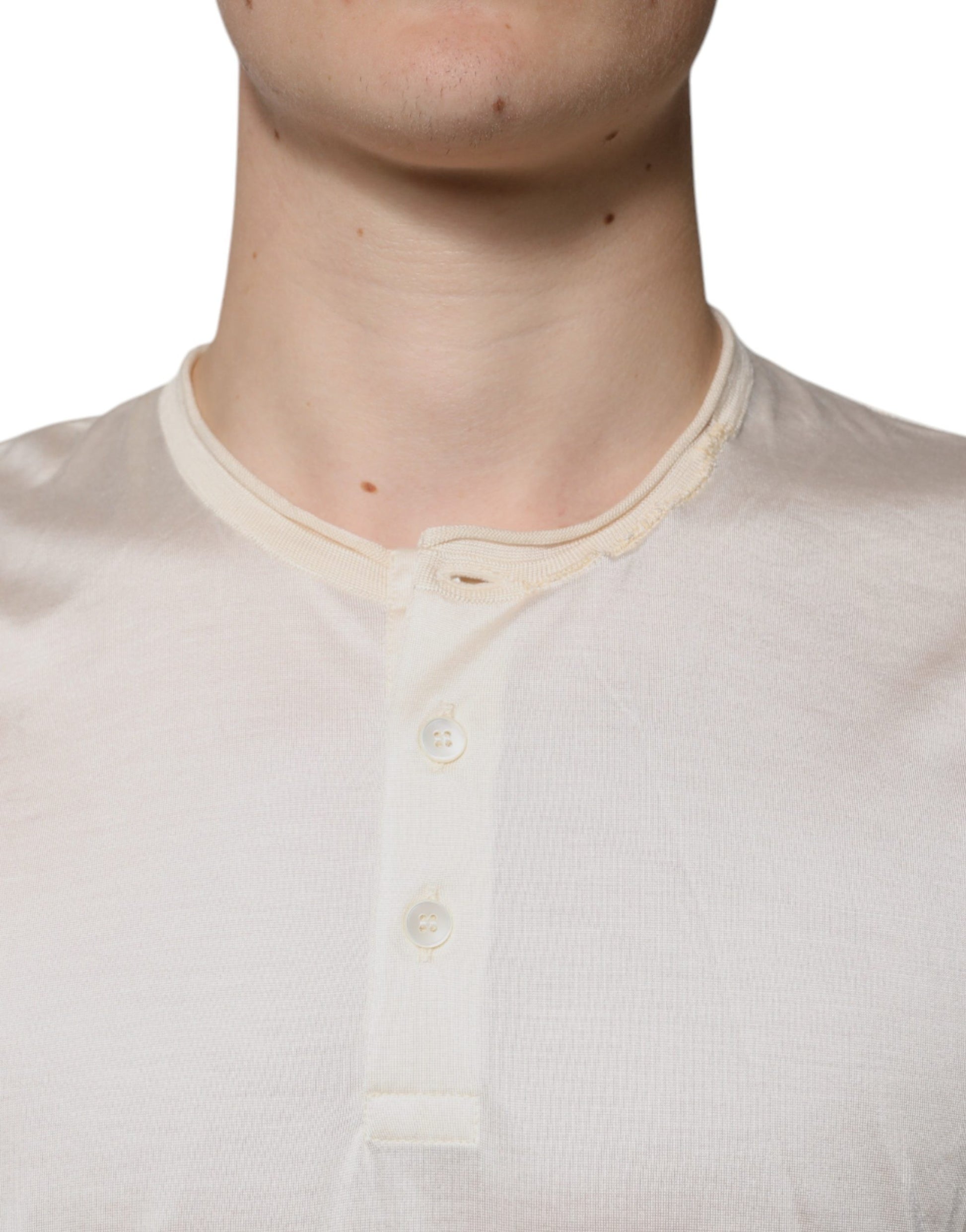 Man wearing a beige baseball jersey