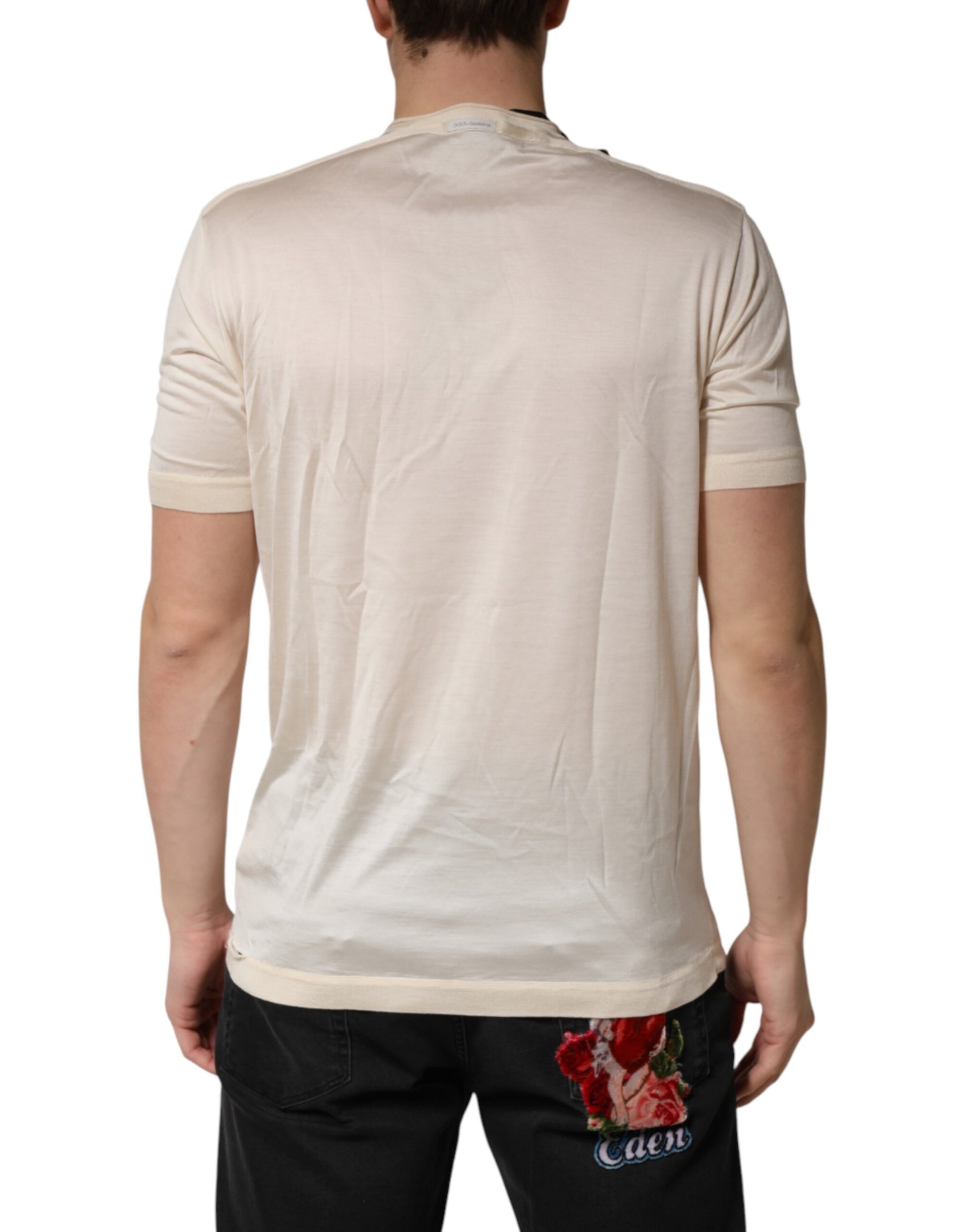 Man wearing a short sleeve shirt with floral pattern on back