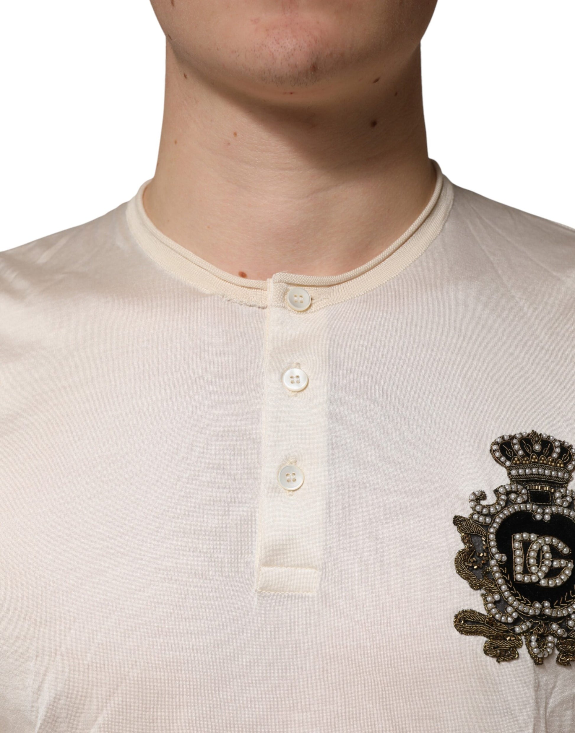 Man wearing a beige sweater with buttons