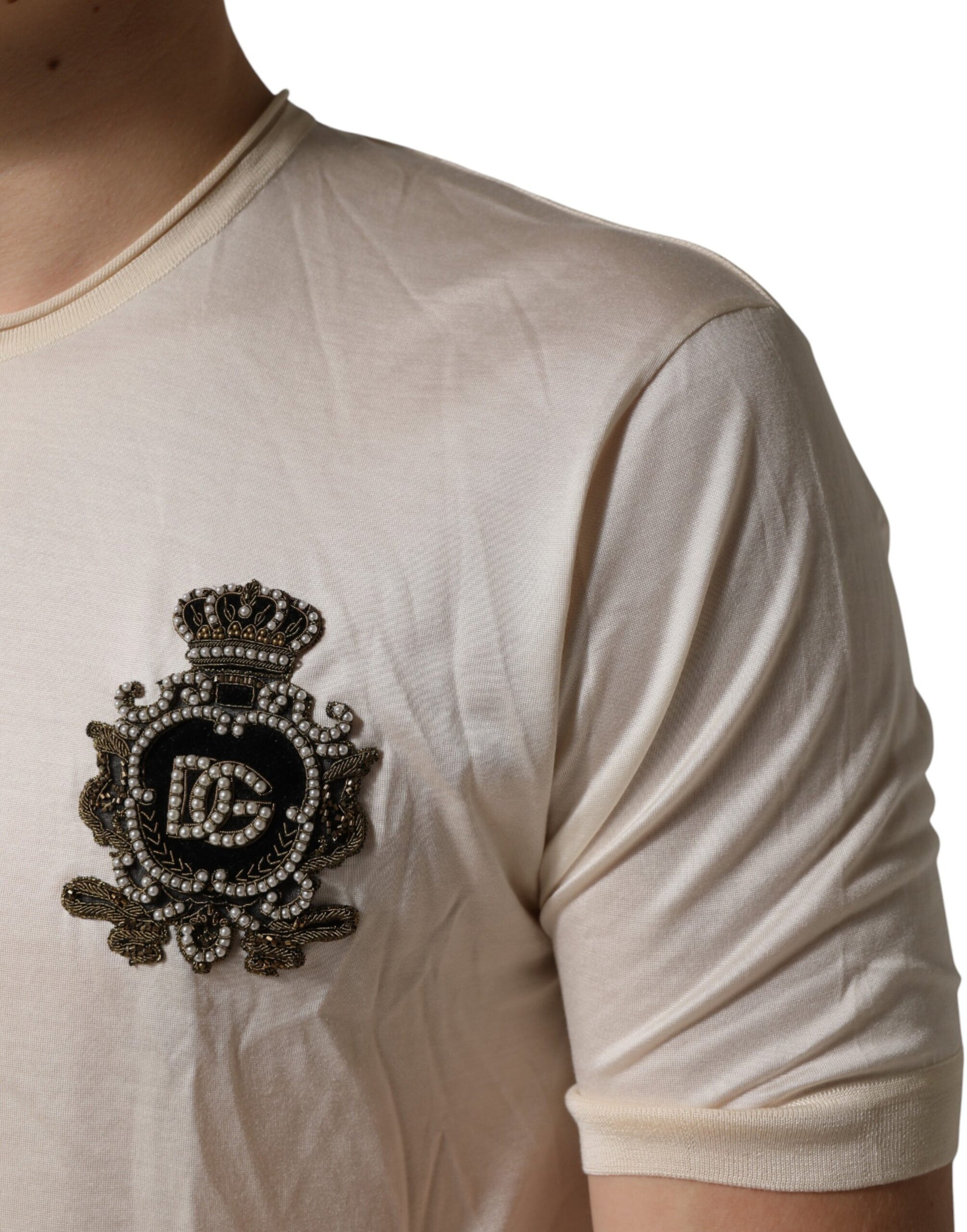 White short sleeve shirt with embroidered emblem on left shoulder