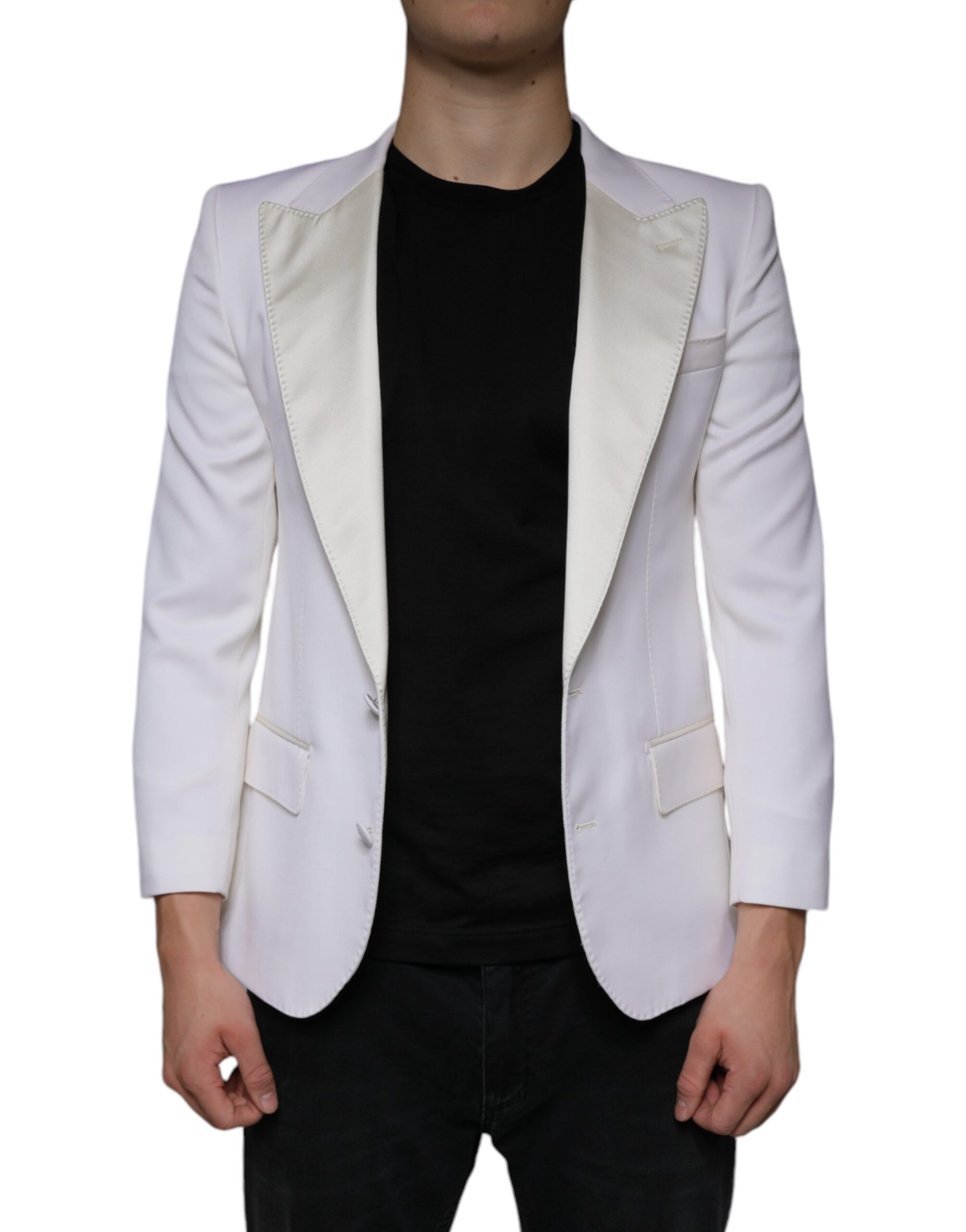 A person wearing a white blazer with black sleeves and collar