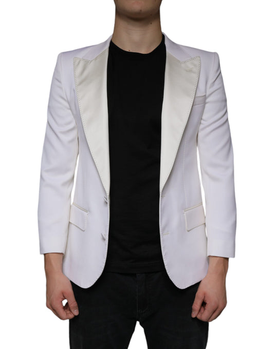 A person wearing a white blazer with black sleeves and collar