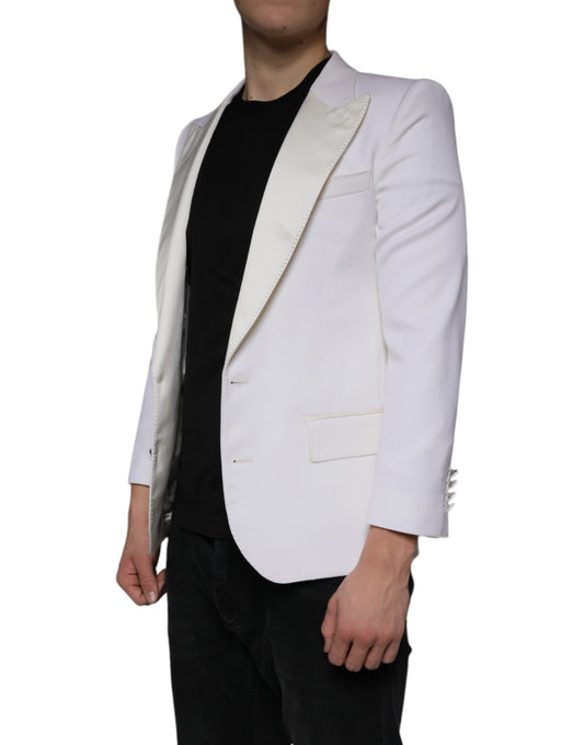 A mannequin wearing a white blazer with black sleeves and lapels