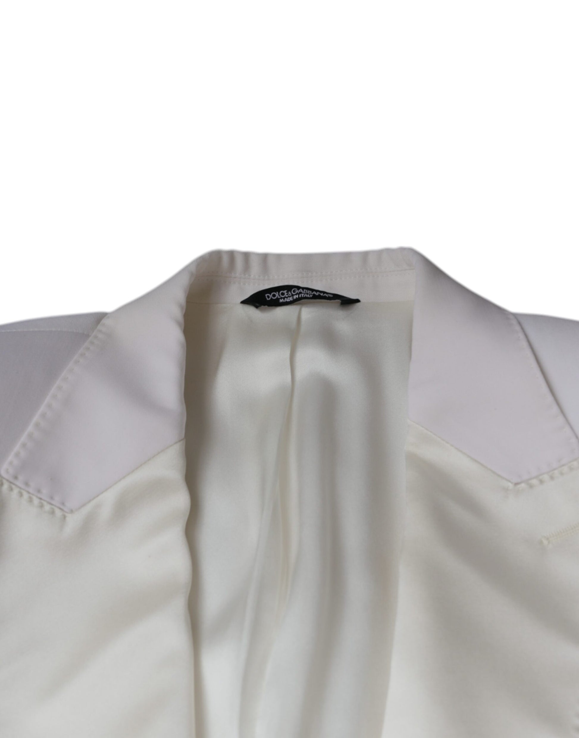 A single-breasted blazer with a notched collar, made of off-white wool