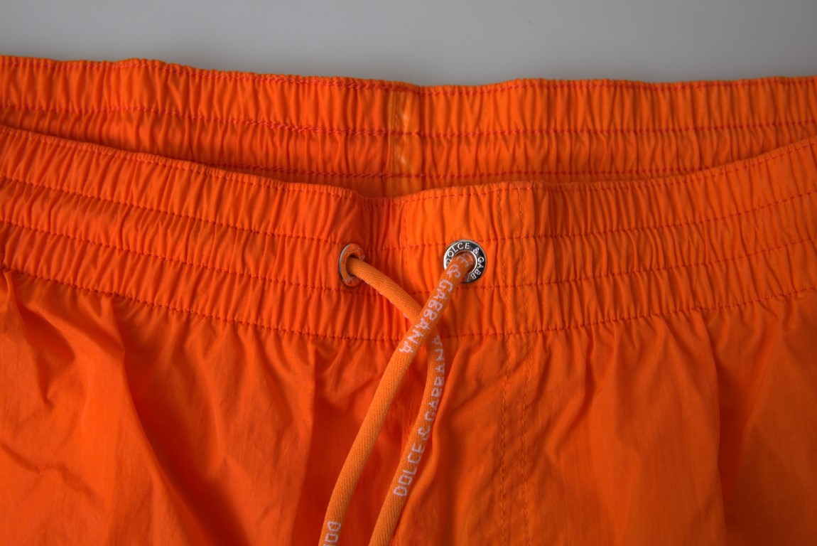 Orange swim trunks with drawstring tie