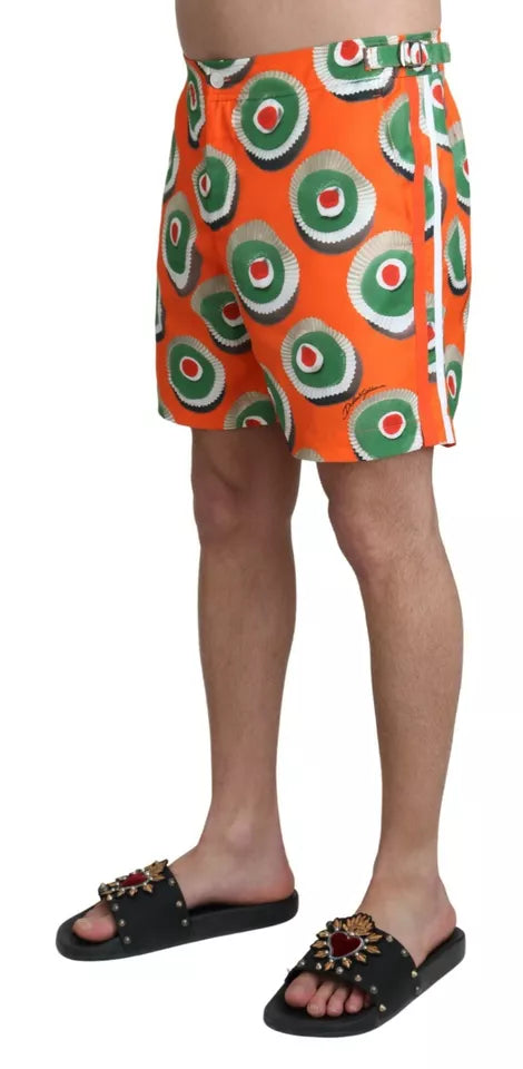 Men's swim trunks with a colorful pattern featuring red circles