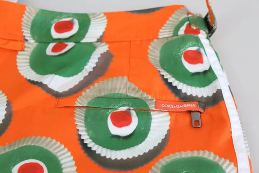 Colorful fabric with green icing on red background