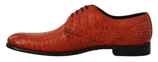 Red patent leather shoes with laces and a shiny finish