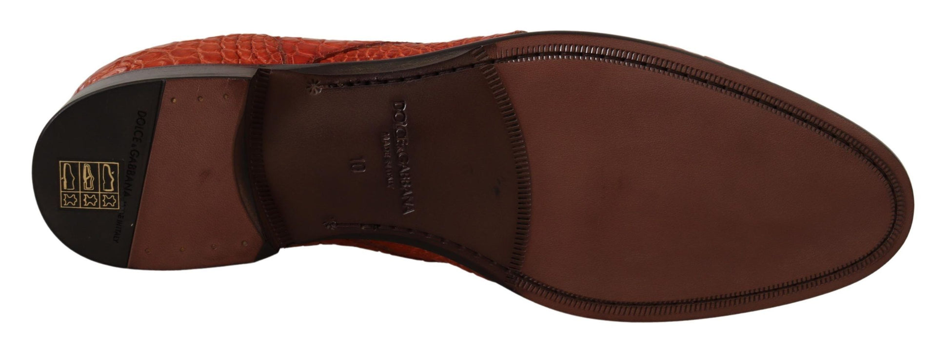 Brown shoe with red laces and a black logo on the side