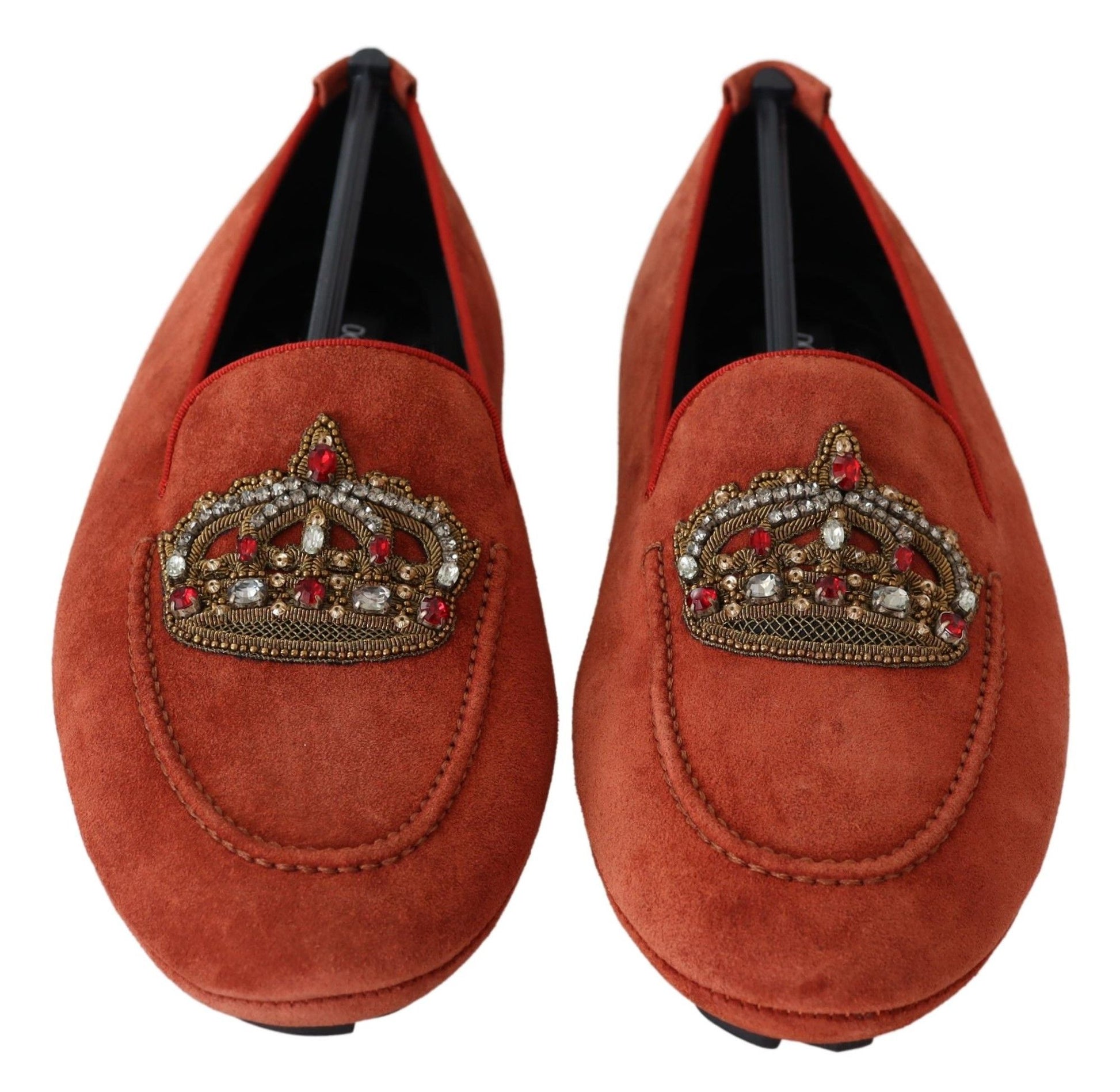 Pair of red velvet loafers with embroidered crown and gemstones on heel