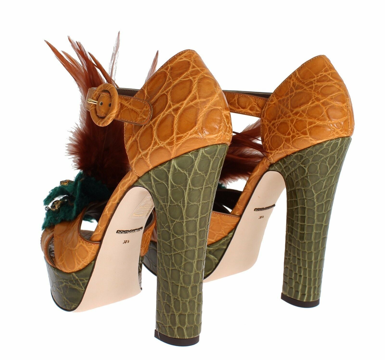 Pair of high heel shoes with crocodile skin texture and feather trim