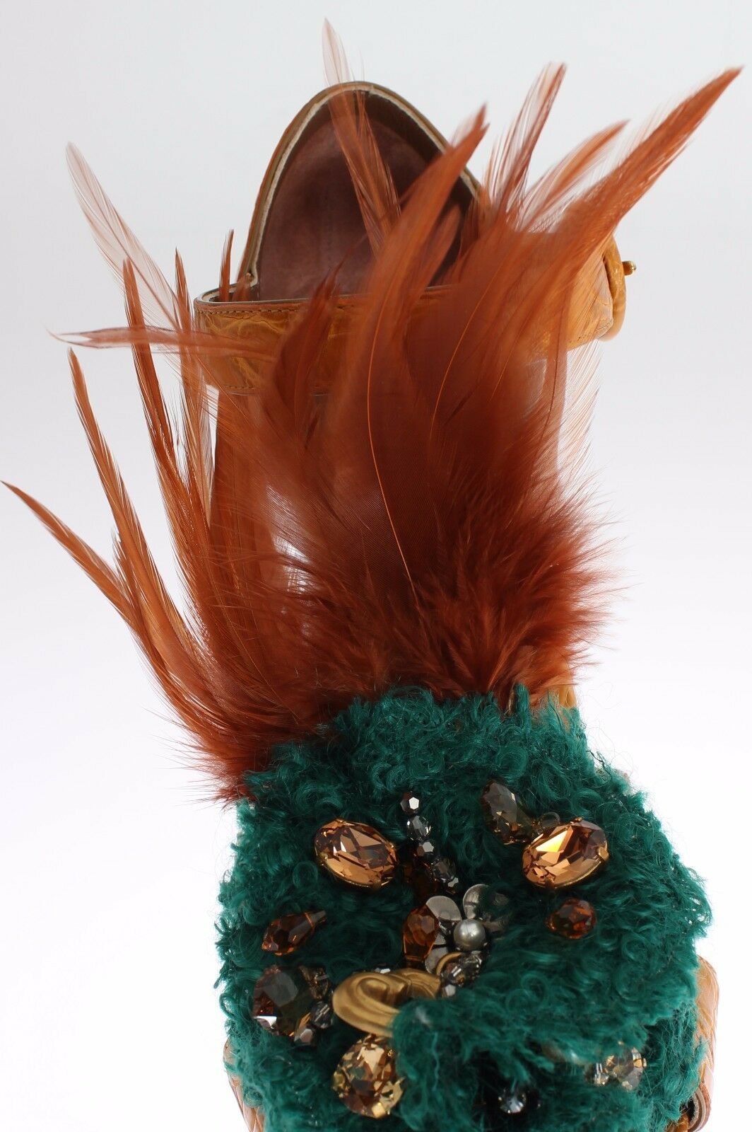 Feathered heel with green base and orange feathers