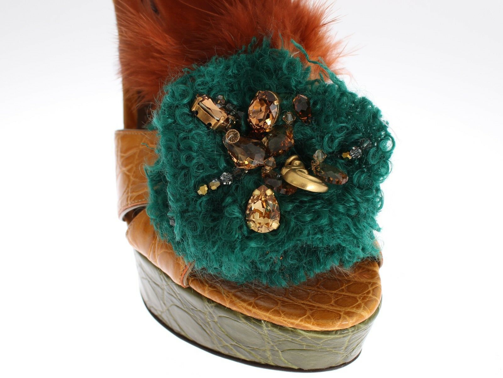 Brown leather shoe with green fur trim and gold jewel embellishments