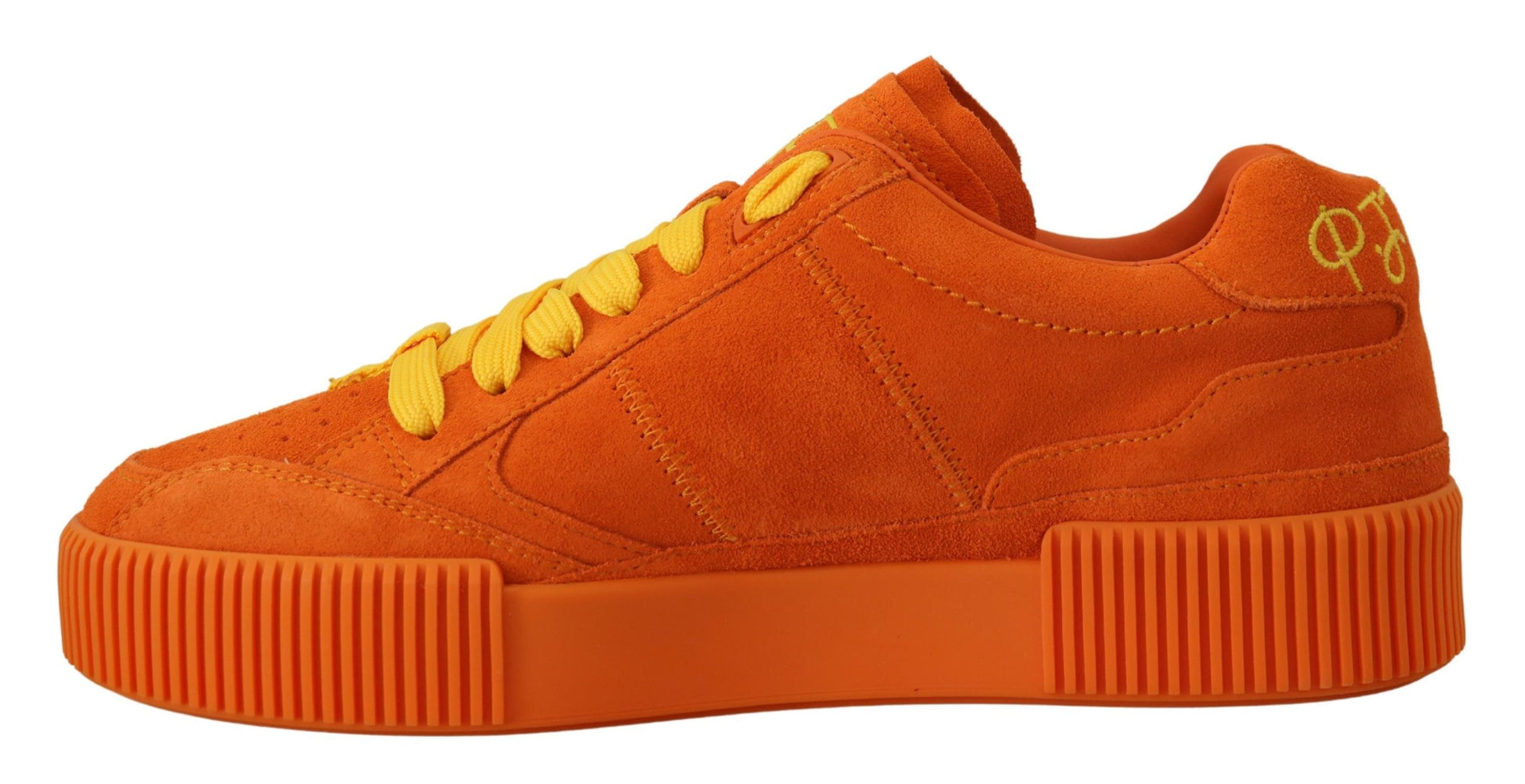 A pair of orange sneakers with yellow laces and a white logo on the side. They have a chunky sole design
