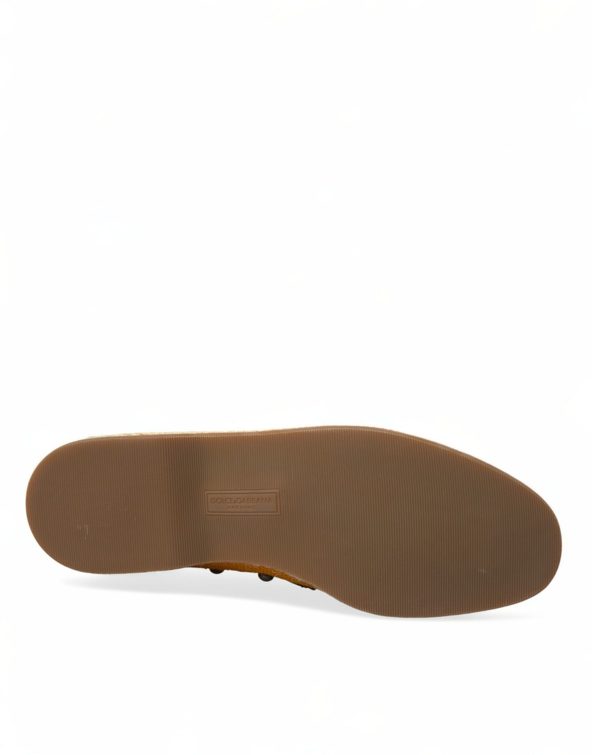 Brown shoe sole with visible stitching and logo