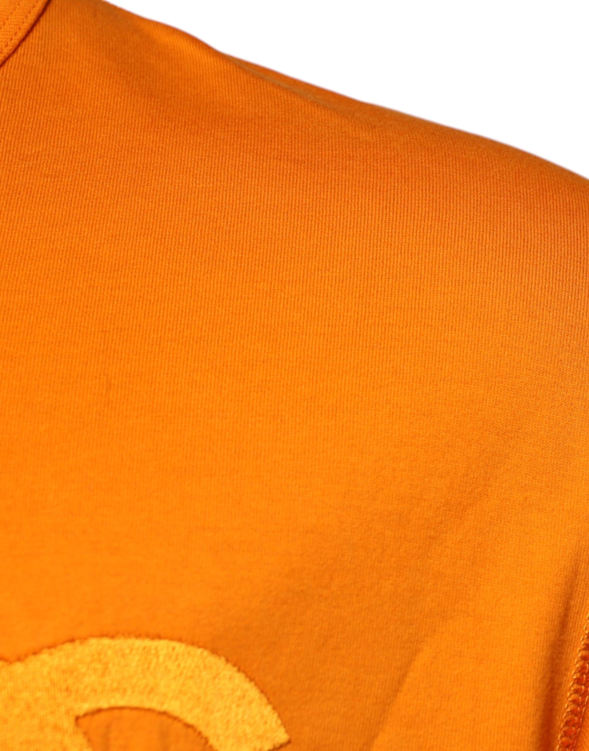 Orange shirt with white logo on front