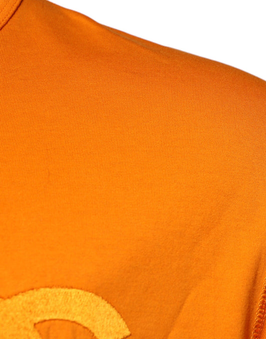 Orange shirt with white logo on front