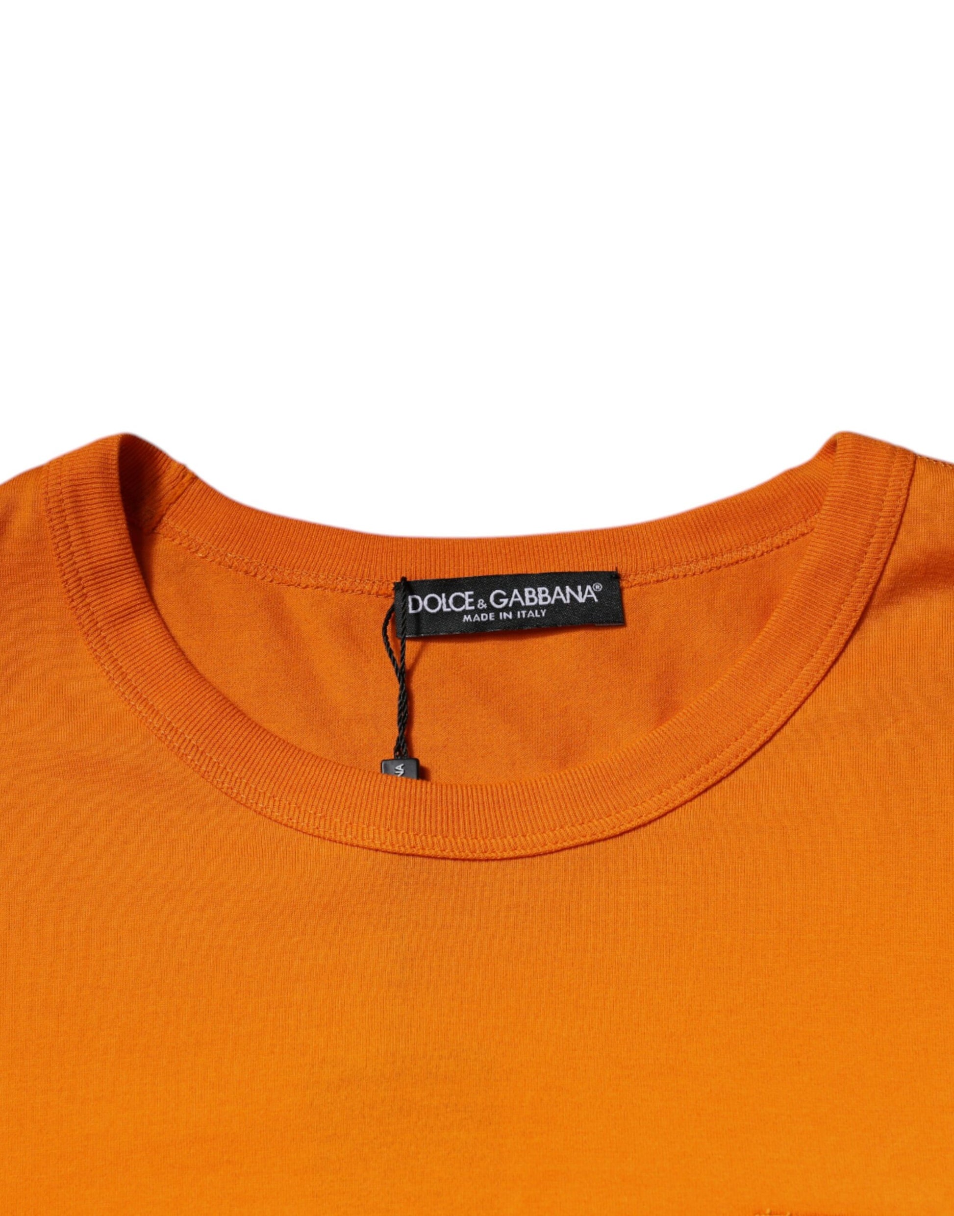 Orange crew neck t-shirt with black label on collar