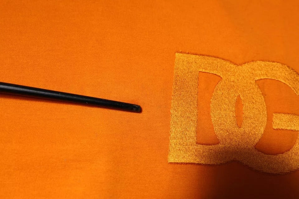 Black thread on orange fabric