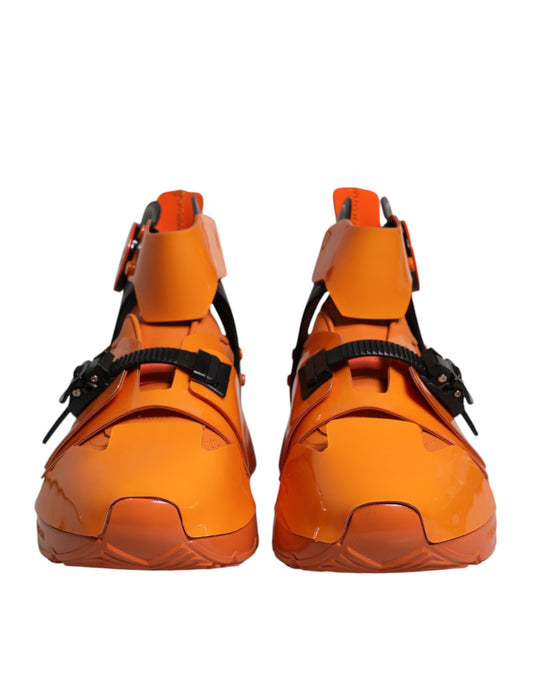 Pair of orange high top sneakers with black laces and straps