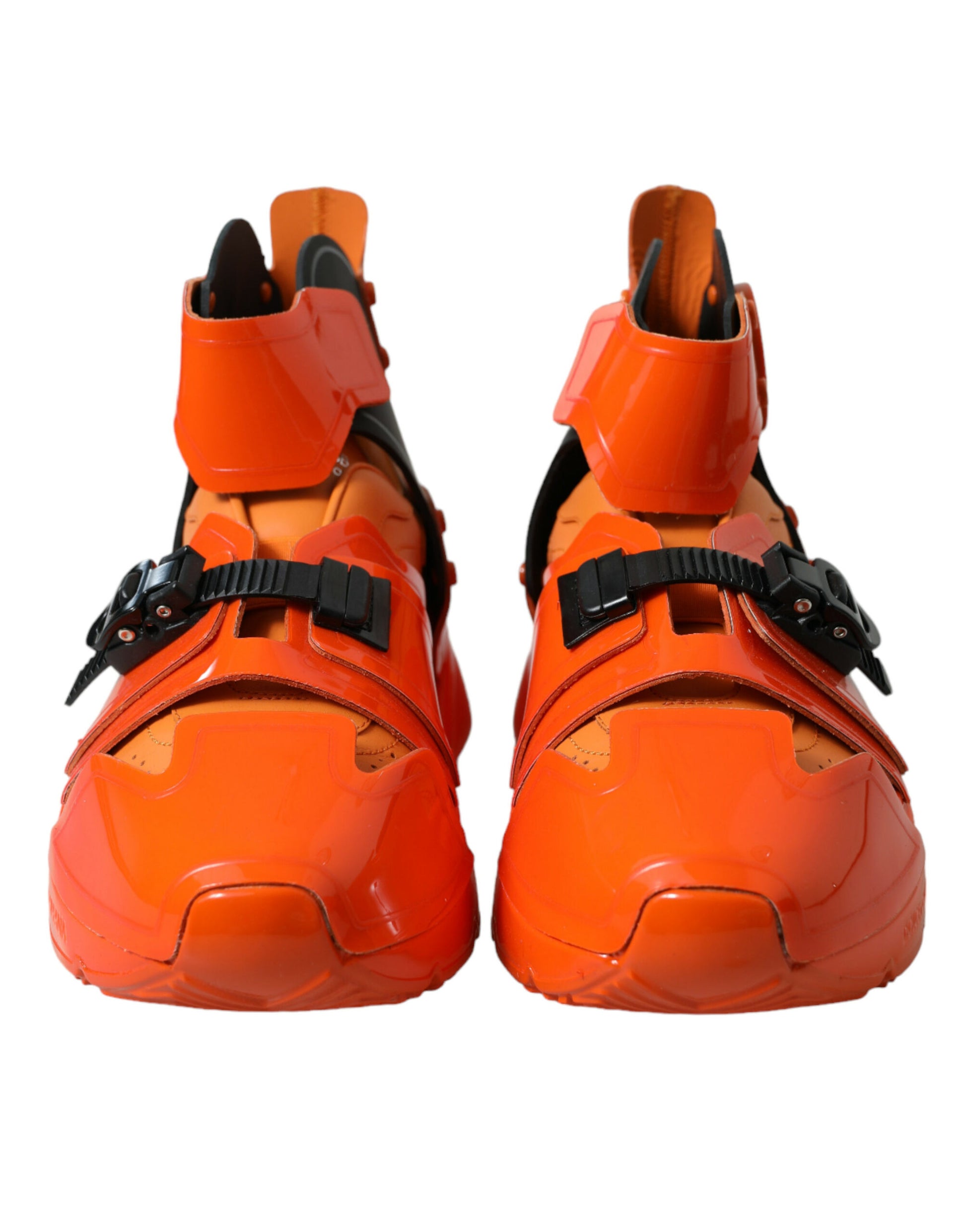 Pair of red hiking boots with straps and buckles