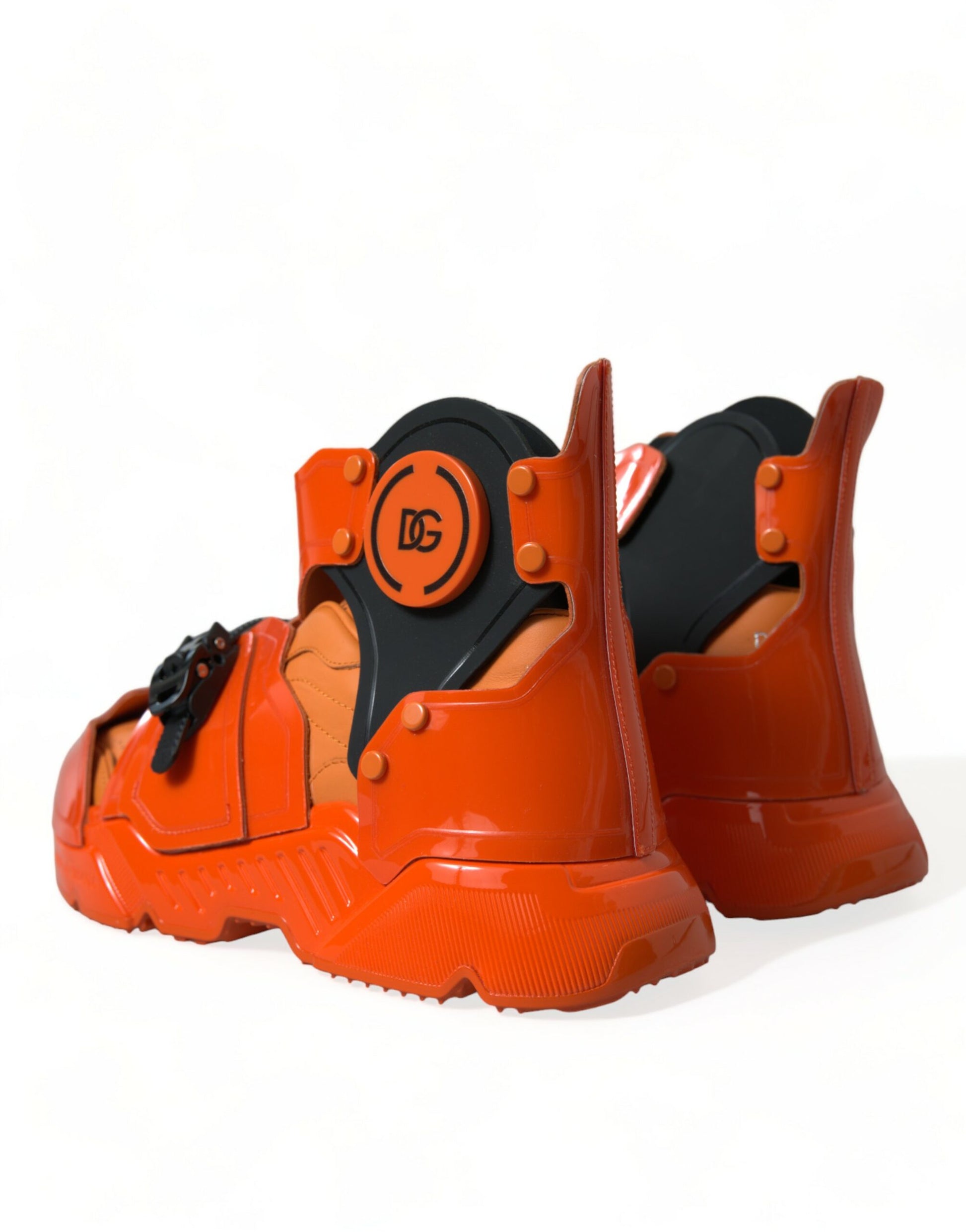 Red boots with black straps and a circular logo on the side