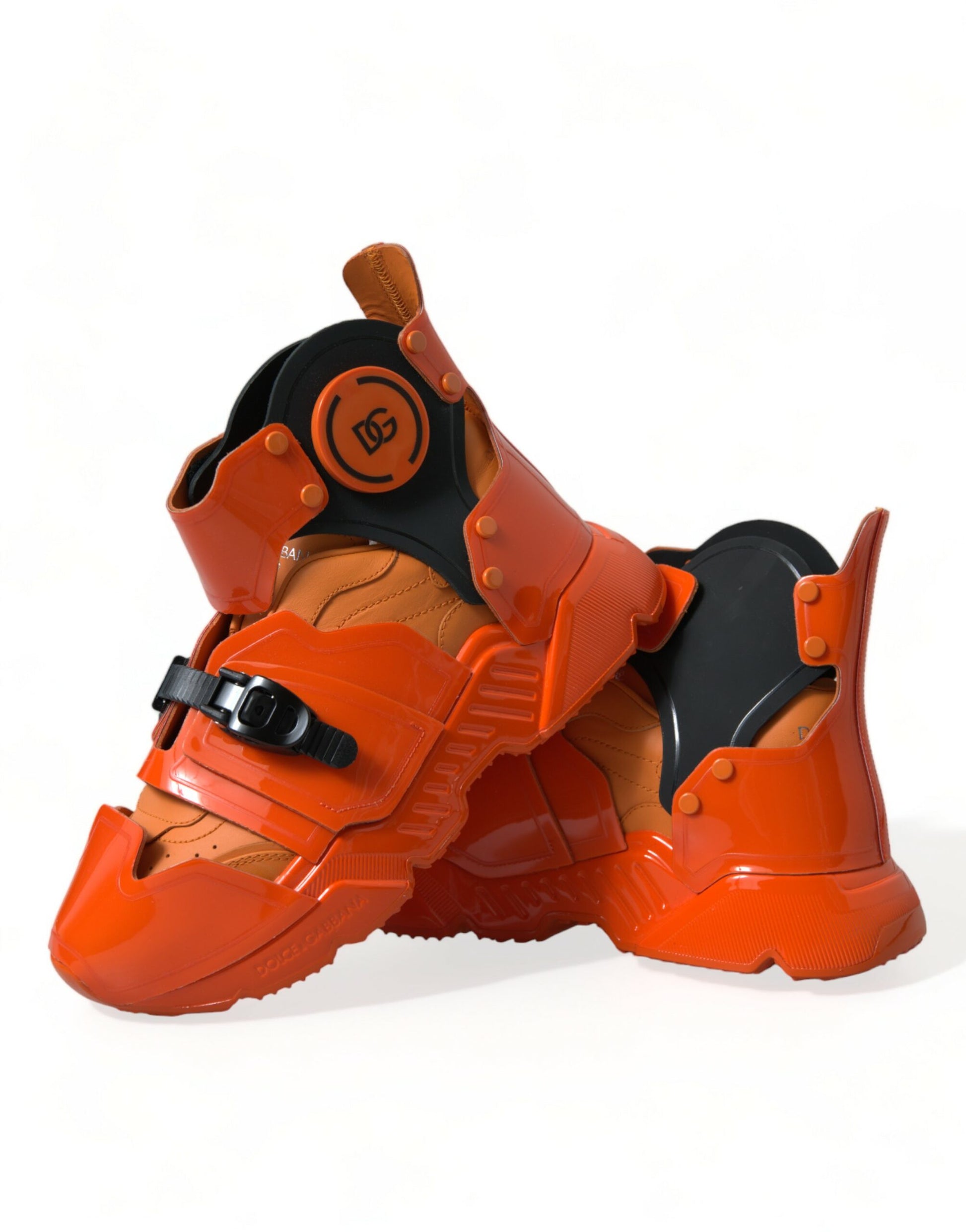 Pair of red and black sneakers with orange accents