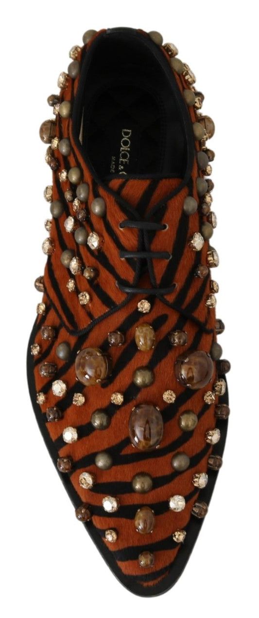 Red shoe with gold studs and a tiger print pattern