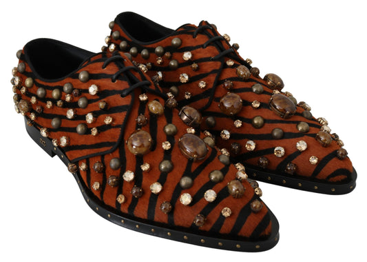 Pair of red shoes with embellishments and laces