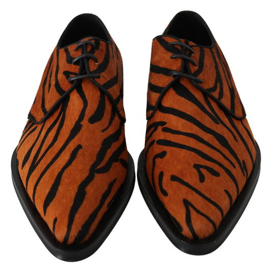 Pair of men's shoes with tiger print design and black laces