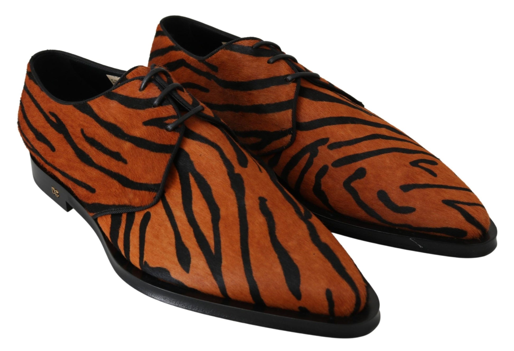 Pair of red and black tiger print shoes with laces